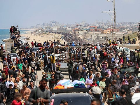Palestinians, who were displaced by Israel's military offensive on south Gaza, make their way as they attempt to return to their homes in north Gaza, amid the ongoing conflict between Israel and Hamas, as seen from central Gaza Strip April 14, 2024.  