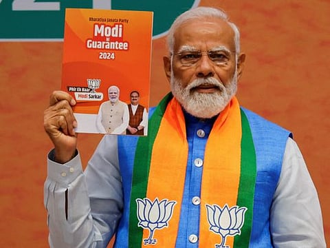 Modi releases the BJP election manifesto 'Sankalp Patra' at the party headquarters extension in New Delhi on Sunday. He is flanked by federal Home Minister Amit Shah, Defence Minister Rajnath Singh, Finance Minister Nirmala Sitharaman and party President JP Nadda.