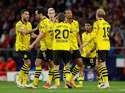 Dortmund's Sebastien Haller (third from right) celebrates with teammates after scoring his team's first goal during the Champions League quarter-finals first leg against Atletico Madrid.