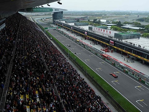 A view shows spectators watching the Formula One Chinese Grand Prix in Shanghai on April 14, 2019. Two years ago the Shanghai International Circuit hosted a Covid hospital, but this weekend it will stage Formula One once more as the sport returns to China for the first time since the pandemic.