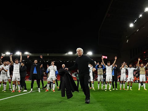 Atalanta coach Gian Piero Gasperini celebrates after the Europa League quarter-final first leg match against Liverpool at Anfield on April 11.