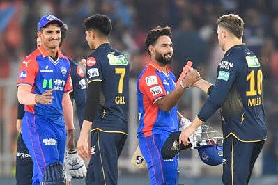 Gujarat Titans' captain Shubman Gill greets Delhi Capitals' players after their win at the end of Indian Premier League match at the Narendra Modi Stadium in Ahmedabad on Wednesday.