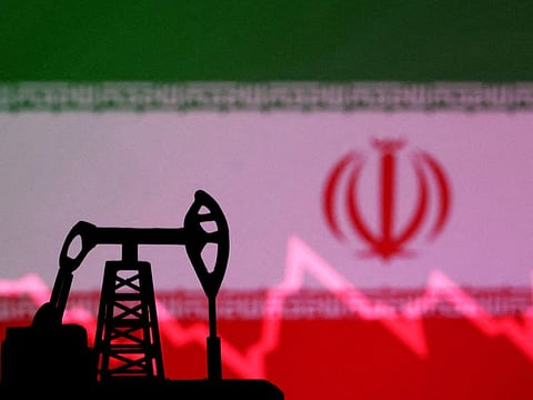 Iranian flag with stock graph and an oil pump jack miniature model are seen in this illustration taken October 9, 2023. After Britain, the European Union and the United States slapped new measures on IranREUTERS/Dado Ruvic/Illustration/File Photo