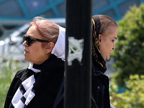 Iranian women walk through downtown Tehran on April 13, 2024. Police in Iran announced a new crackdown on April 13 on women who ignore the country's strict Islamic dress code that makes it compulsory for them to wear headscarves in public.   