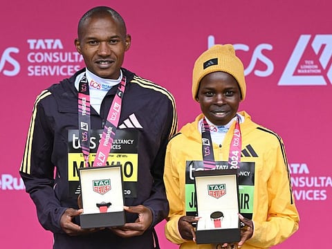 Winners of the men's and women's races, Kenya's Alexander Mutiso Munyao (left) and Kenya's Peres Jepchirchir pose with their awards at the presentations for the 2024 London Marathon on Sunday.