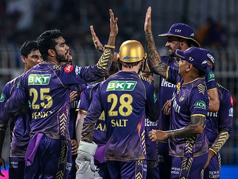 Kolkata Knight Riders' Venkatesh Iyer (left) celebrates with teammates after taking a catch to dismiss Royal Challengers Bengaluru's captain Faf du Plessis during the Indian Premier League cricket match at the Eden Gardens in Kolkata on Sunday.