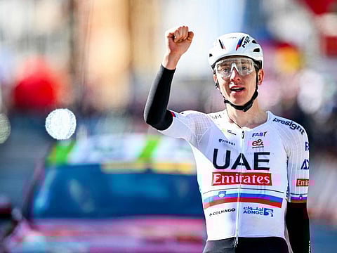 UAE Team Emirates' Slovenian cyclist Tadej Pogacar celebrates after crossing the finish line of the Liege-Bastogne-Liege one day cycling race on Sunday.