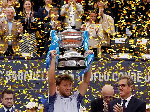Norway's Casper Ruud celebrates with the trophy after winning the Barcelona Open in the final match against Greece's Stefanos Tsitsipas on Sunday.