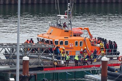 Migrants disembark from a lifeboat as they arrive at Port of Dover in Britain, on April 23, 2024.  