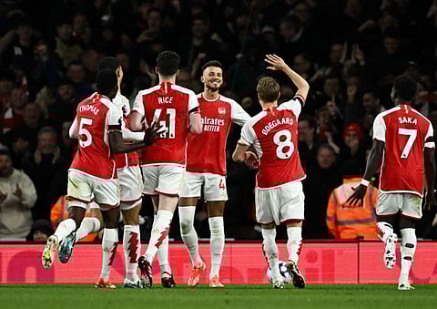 Arsenal's Ben White celebrates scoring their second goal with teammates during a Premier League against Chelsea.