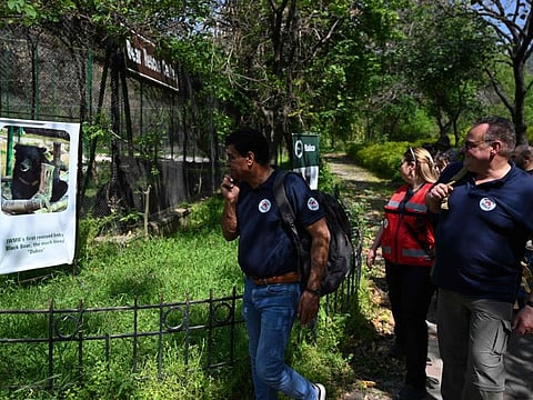 In this picture taken on April 5, 2024, Amir Khalil (left), veterinarian and director of the project development for Four Paws International, and Frank Goeritz (right), head veterinarian of Leibniz Institute for Zoo and Wildlife Research in Berlin, visit the Margallah Wildlife rescue centre, formerly a zoological park, in Islamabad.  