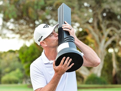 Brendan Steele of the US celebrates with the winner's trophy after the final round of LIV Golf Adelaide at the Grange Golf Club in Adelaide on Sunday.