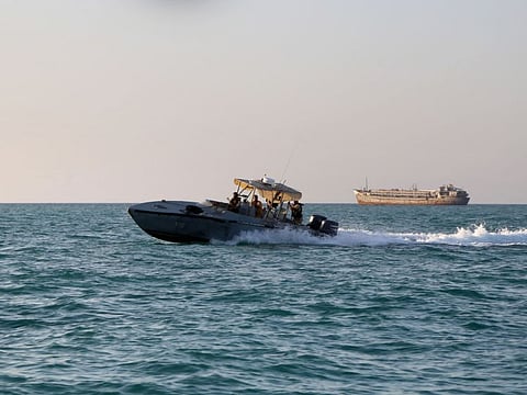 Yemeni coastguards loyal to the internationally-recognised government ride in a patrol boat in the Red Sea off the government-held town of Mokha in the western Taiz province, close to the strategic Bab Al Mandab Strait, on April 15, 2024.  In recent months Saudi Arabia has begun accepting guests at two resorts as part of its Red Sea Global coastal development, while the luxury yachting island Sindalah - part of the futuristic NEOM megacity - is expected to be completed by the end of this year.