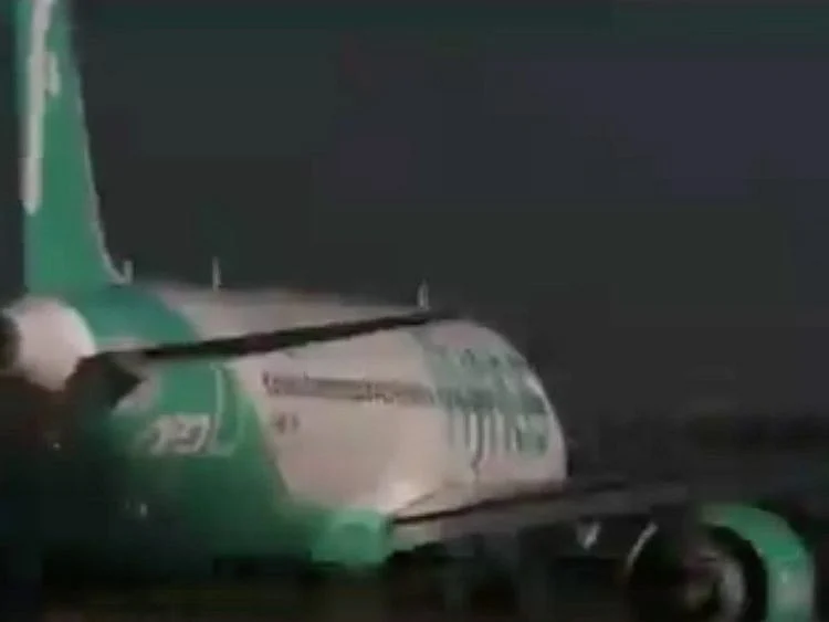 The plane exited the runway and entered the adjacent land corridor, traversing the dirt buffer zone.