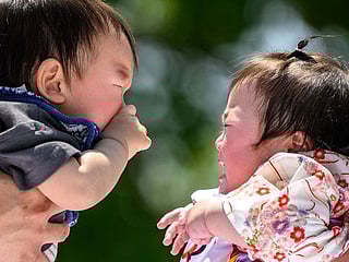 Photos: 100 crying babies face off at sumo festival