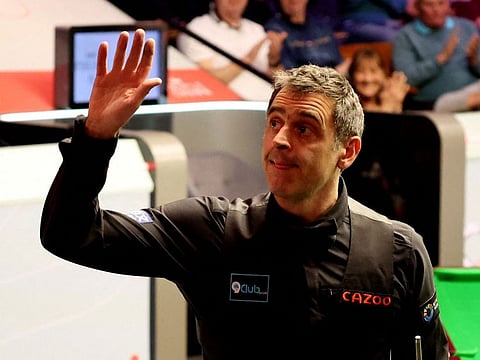 England's Ronnie O'Sullivan celebrates after winning his second round match against Wales' Ryan Day.