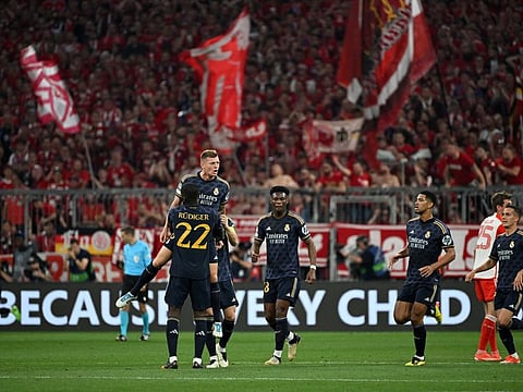 Real Madrid's Toni Kroos celebrates with teammates after Vinicius Junior scores their first goal during the Champions League semi-final first leg against Bayern Munich at Allianz Arena, Munich, on Tuesday.