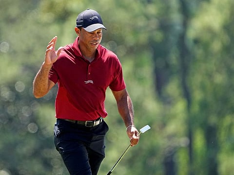 Tiger Woods walks onto the 18th green during the final round of the Masters Tournament.