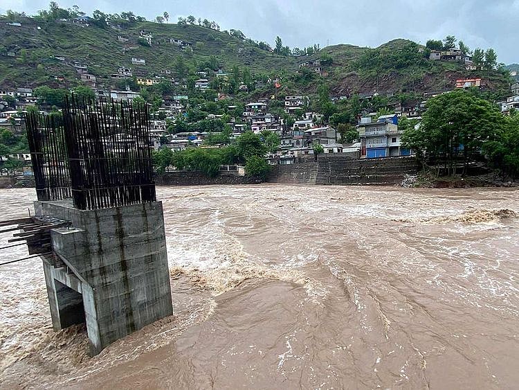 A general view of an overflowing Jhelum River after heavy rainfall in Muzaffarabad in Pakistan-administered Kashmir on April 29, 2024.