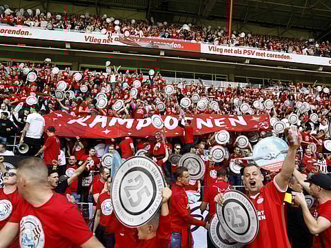 PSV supporters cheer during the Dutch Eredivisie football match between PSV Eindhoven and Sparta Rotterdam at the Phillips stadium, in Eindhoven, on Sunday.