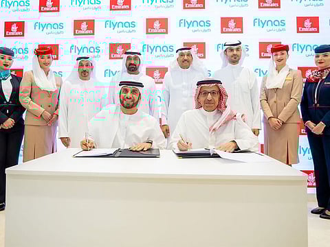 Adnan Kazim (left), Emirates' Deputy President and Chief Commercial Officer, and Bander Almohanna, Group CEO and Managing Director of flynas, in the presence of Sheikh Ahmed bin Saeed Al Maktoum, Chairman and Chief Executive, Emirates Airline & Group, and flynas Chairman Ayed Al Jeaid, along with other senior representatives from both airlines.
