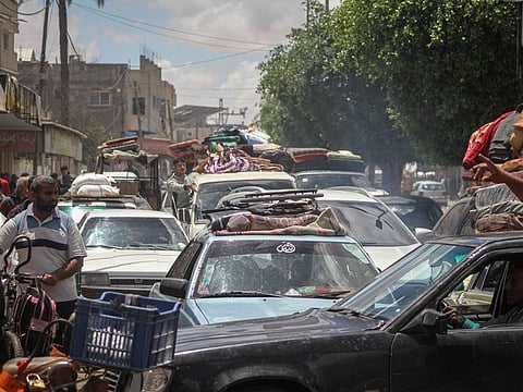 Palestinians flee following Israeli army orders to evacuate the eastern side of the city, ahead of military operations in Rafah, on  May 6, 2024.  