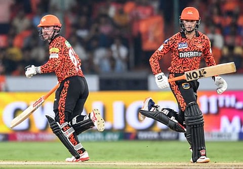 Sunrisers Hyderabad's Travis Head (left) and Abhishek Sharma run between the wickets during the Indian Premier League (IPL) Twenty20 cricket match against Lucknow Super Giants at the Rajiv Gandhi International Stadium in Hyderabad on Wednesday.