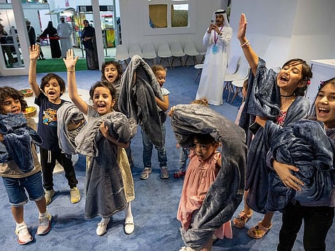 Journey into the world of 'Leila and the Wolf': Children at the Wild Mask workshop were given a small blanket each to wrap themselves  in a reminder of Leila’s grandmother who was sleeping under a blanket before the wolf replaced her on the bed.