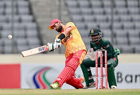 Zimbabwes captain Sikandar Raza in action as Bangladeshs Wicketkeeper Jakir Ali looks on during the fifth Twenty20 international cricket match at the Sher-E-Bangla National Cricket Stadium in Dhaka on Sunday.