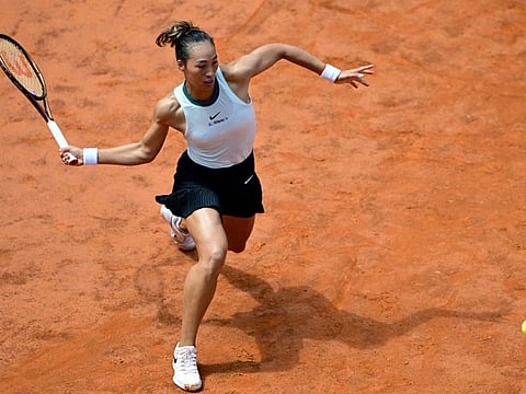 China's Qinwen Zheng returns to Japan's Naomi Osaka during the Women's WTA Rome Open tennis tournament at Foro Italico in Rome on Monday.