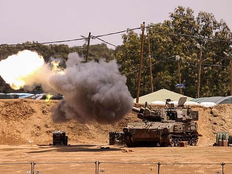 Israeli battle tanks take position in southern Israel near the border with the Gaza Strip on May 13, 2024.