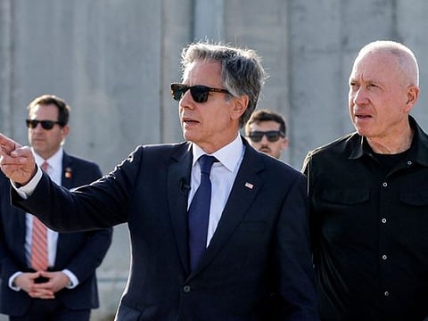  US Secretary of State Antony Blinken gestures as he walks with Israeli Defence Minister Yoav Gallant at the Kerem Shalom border crossing with the Gaza Strip in southern Israel on May 1, 2024.  