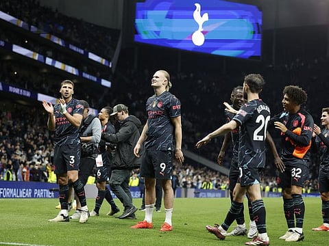 Manchester City's Erling Braut Haaland with teammates celebrate after the Premier League match against Tottenham Hotspur at Tottenham Hotspur Stadium, London, on May 14.