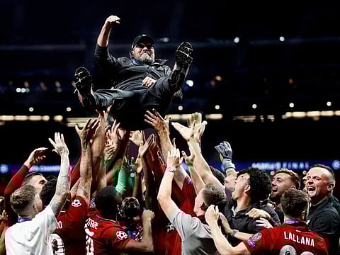Liverpool manager Juergen Klopp is thrown in the air by his players as they celebrate after winning the Champions League Final  FILE PHOTO: Soccer Football - Champions League final against Tottenham Hotspur in Madrid on June 1, 2019.  