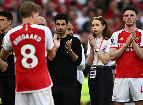 Arsenal's Declan Rice and manager Mikel Arteta react after the Premier League match against Everton at Emirates Stadium, London, on Sunday.