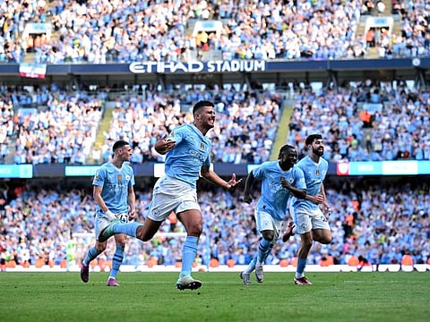 Manchester City's Spanish midfielder Rodri celebrates scoring the team's third goal during the English Premier League football match against West Ham United at the Etihad Stadium in Manchester, north west England, on Sunday.