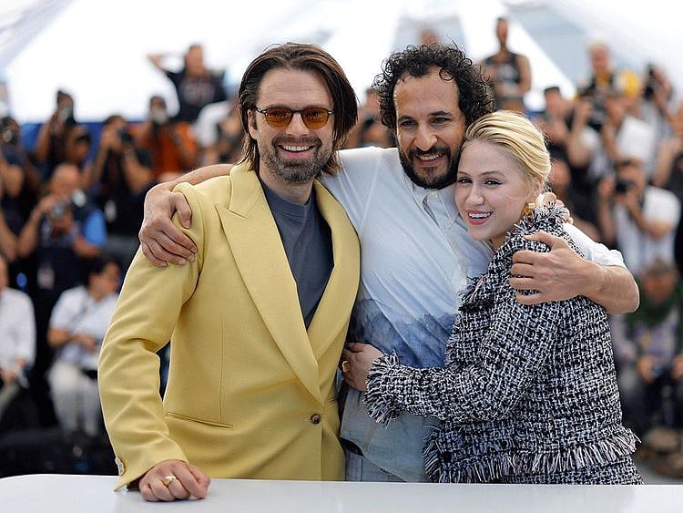 Director Ali Abbasi and cast members Sebastian Stan and Maria Bakalova pose during a photocall for the film "The Apprentice" in competition at the 77th Cannes Film Festival in Cannes, France, May 21, 2024.  