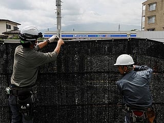 Sick of tourists, Japan town blocks view of Mt Fuji