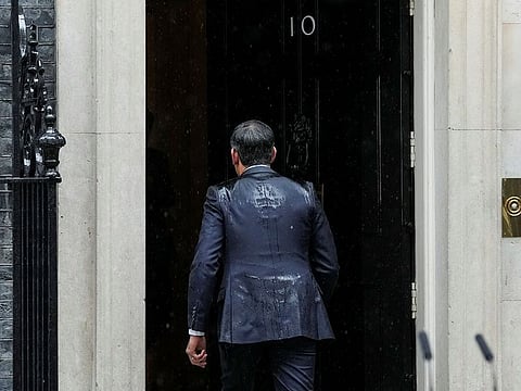 British Prime Minister Rishi Sunak enters Number 10 Downing Street, after delivering a speech calling for a general election, in London, Britain