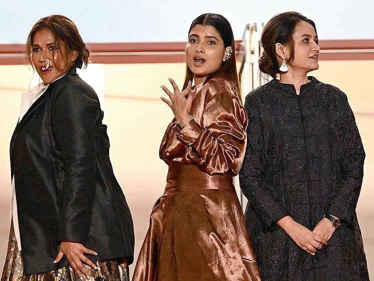 From left: Indian actress Chhaya Kadam, Indian actress Divya Prabha and Indian director Payal Kapadia arrive for the screening of the film "All We Imagine as Light" 