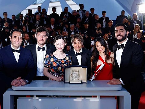 Director Sean Baker, Palme d'Or award winner for the film "Anora", poses with Vache Tovmasyan, Samantha Quan, Mikey Madison, Alex Coco and Karren Karagulian during a photocall after the closing ceremony of the 77th Cannes Film Festival in Cannes, France, May 25, 2024. 