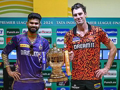 Kolkata Knight Riders’ captain Shreyas Iyer (left) and Sunrisers Hyderabad’s skipper Pat Cummins pose with the Indian Premier League trophy during a press conference at the MA Chidambaram Stadium in Chennai on May 25, 2024. The teams clash in Sunday’s final. 