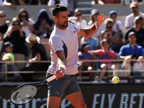 Serbia's Novak Djokovic takes part in a practice session at the Roland Garros Complex in Paris.