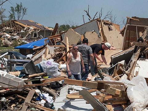 Residents continue recovery and cleanup efforts with the help of family and friends following Tuesday's destructive tornado on May 23, 2024 in Greenfield, Iowa. The storm was responsible for several deaths in the small community.   