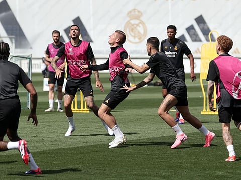 Real Madrid's Spanish forward Joselu and German midfielder Toni Kroos (centre) attend a training session at the Santiago Bernabeu stadium in Madrid on Monday.