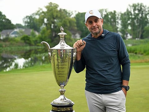 Richard Bland poses with the Senior PGA Championship trophy