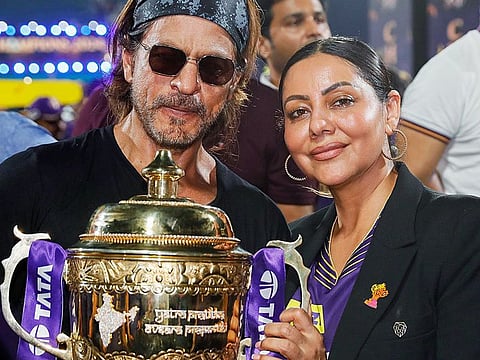 Kolkata Knight Riders (KKR) co-owner Shah Rukh Khan with his wife Gauri Khan pose for a picture with the Indian Premier League 2024 trophy, at MA Chidambaram Stadium in Chennai on Sunday. 