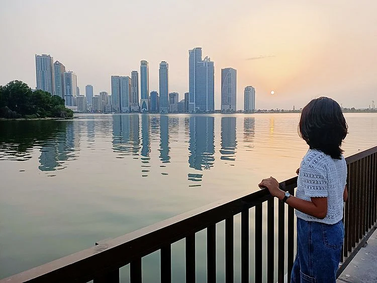 A sunset view from Khalid Lagoon in Buhaira Corniche, Sharjah. Sharjah skyline