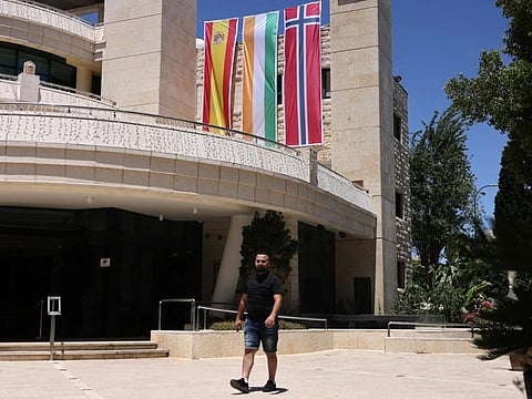 A municipality building in the West Bank city of Ramallah is adorned with flags of Spain, Ireland and Norway.  