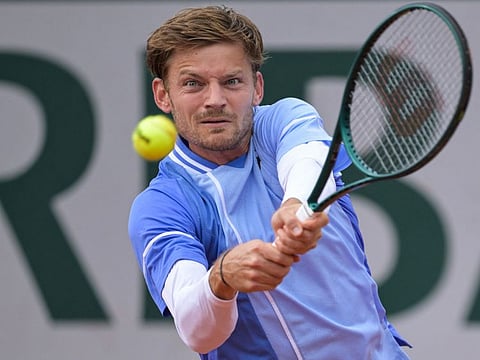Belgium's David Goffin plays a backhand return to France's Giovanni Mpetshi Perricard during their men's singles match on day three of the French Open tennis tournament at the Roland Garros Complex in Paris on Wednesday.